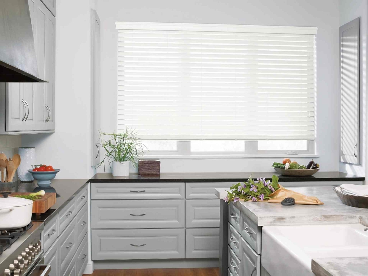 Hunter Douglas EverWood® Faux Wood Blinds as blinds for kitchen windows in a clean, modern kitchen at Delux Drapery & Shade Co. near Ann Arbor,(MI)